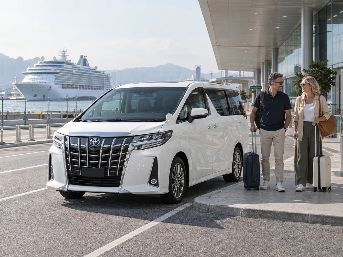 Cruise passengers with luggage meeting an Alphard at a public terminal pickup area